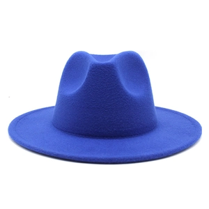 Close-up of a royal blue wide brim felt fedora hat featuring a classic indented crown design