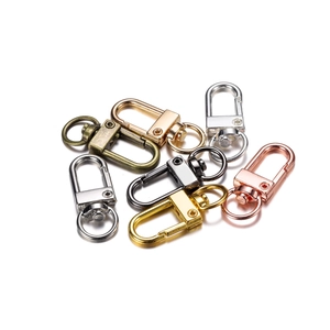 Detailed set of seven colorful swivel snap hooks in gold silver and bronze metal finishes