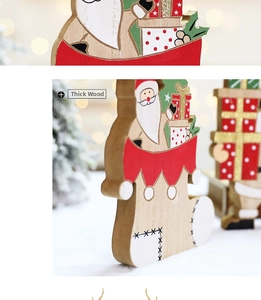 Detail view of the thick wood texture and festive red painted finish of Christmas ornament