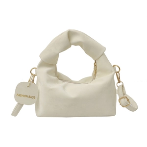 Chic beige pleated crescent handbag with a knotted handle and adjustable strap