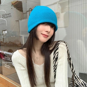 Detailed knit texture and ribbed edge of this electric blue beanie for women