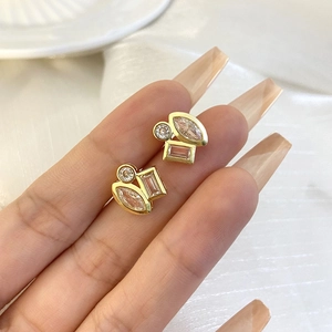 Chic 18K gold plated geometric stud earrings with clear zircon stones on female model