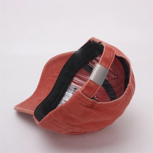 Detail of brick red vintage baseball cap with adjustable metal buckle and inner lining