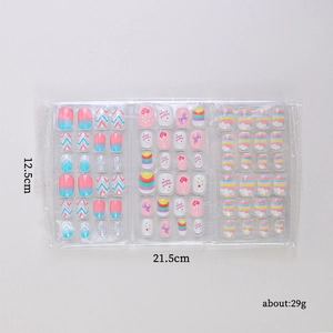 Cartoon press-on nails for kids with unicorn and rainbow designs in 3-sheet gift pack