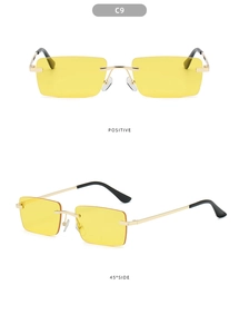 Frameless rectangular yellow lens sunglasses with gold metal frame and black temple tips