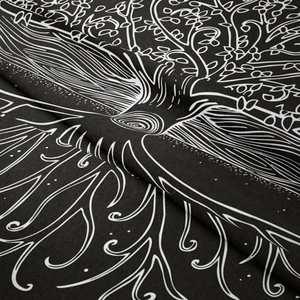 Close-up detail of the black and white Tree of Life pattern on a soft fabric tapestry