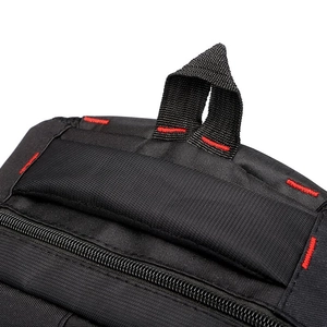 Close-up of durable black backpack handle with reinforced red stitching for extra strength