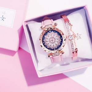 Rose gold quartz watch and star bracelet set in a premium pink gift box detail