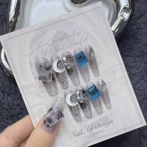Blueberry ice crystal press-on nails with blue gems, silver glitter, and 3D roses
