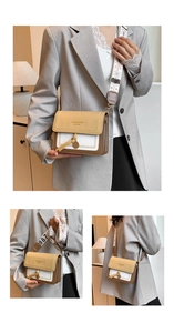 Detail of color-block flap crossbody bag with patterned wide strap and embossed text