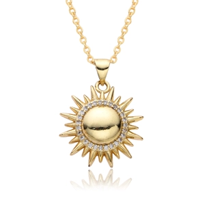 Detailed view of a gold-plated sun pendant necklace featuring shimmering cubic zirconia stones