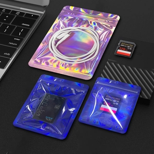 Holographic laser resealable bags for jewelry and small tech accessories shown on desk