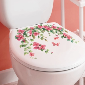 Detail of floral watercolor toilet lid decal with pink flowers and green leaves