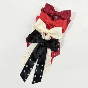 Elegant satin bow hair clips set with pearls in wine red, cream, and black colors