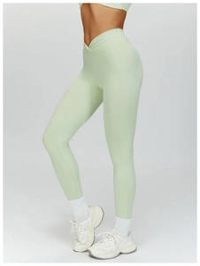 Detailed view of high-waist V-shaped crossover yoga leggings with curved stitching