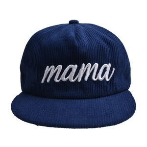 Detail of navy blue corduroy baseball cap with white cursive mama embroidery