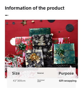 Detail of Christmas wrapping paper rolls with snowflake and bow patterns on gift boxes