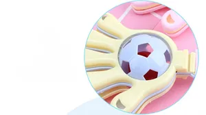 Close-up of baby rattle with smooth macaron finish and spinning football bell component