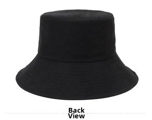 Detail view of the black cotton sun hat interior texture and the reversible side fabric