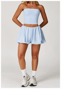 Detail showing high-waisted bubble shorts and matching bandeau top in light blue