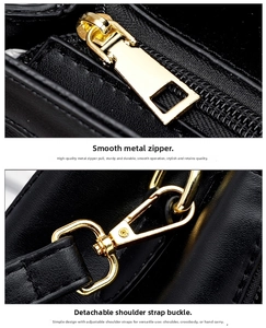 Detail of premium golden metal zipper and detachable strap buckle on black leather handbag