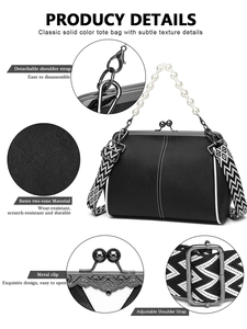 Detail display of black tote bag showing metal clip, retro texture and detachable strap