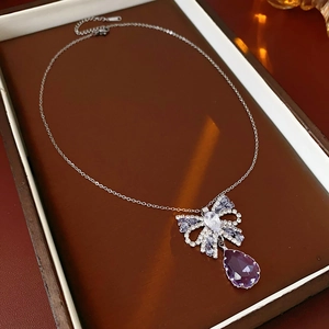 Detailed macro view of S925 silver stamp on jewelry with purple drop gemstone