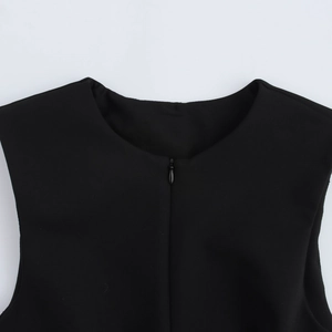 Detail of round neck black sleeveless vest featuring a clean texture and invisible zipper