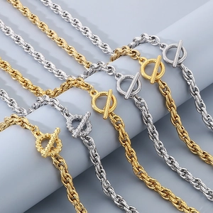 Detailed view of twisted rope chains with toggle clasps in gold and silver steel finish