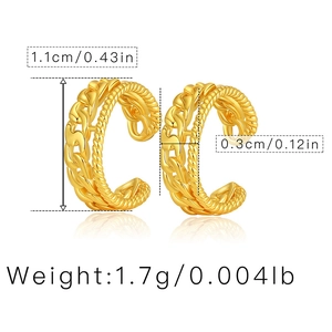 Detailed macro view of dual-layer C-shaped gold ear cuff with twisted rope and curb chain texture