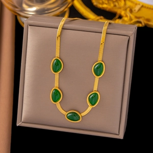 Elegant gold snake chain necklace featuring five emerald green oval gemstone pendants