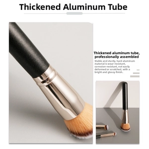 Macro detail of thickened aluminum tube and matte black handle on makeup brush