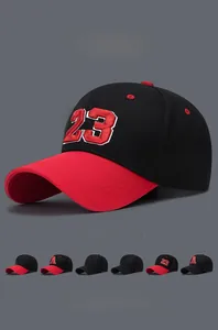 Close-up of number 23 embroidery on a black and red contrast baseball cap with mesh eyelets