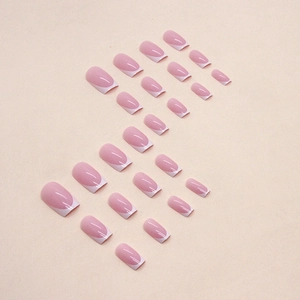 Classic white French tip press-on nails with a minimalist nude pink base in medium length