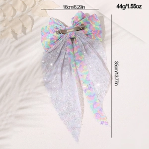 Detail view of colorful sequin bow hair clip showing 16cm width and 35cm length dimensions