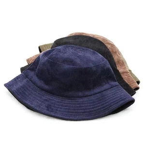 Detailed stack of corduroy bucket hats in navy blue, black, brown, and olive green