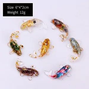 Top view of seven colorful crystal resin koi fish figurines with gold leaf flakes