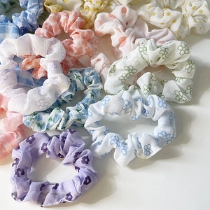 Floral and checkered chiffon scrunchies set in pastel colors for women hair styling
