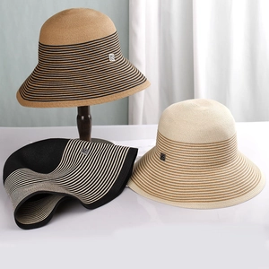 French vintage striped straw bucket hats in brown, black and beige with metal logo