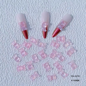 Macro view of 3D resin bear nail charms with pink glitter jelly texture 8x10mm size