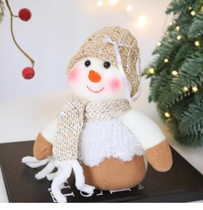 Close-up of a plush snowman doll with sequined scarf and hat for Christmas decor