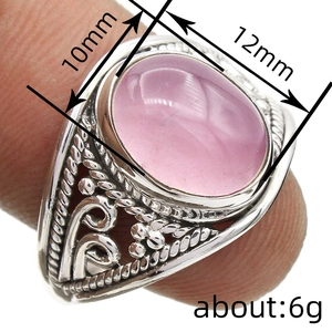 Vintage bohemian silver ring with oval pink gemstone and intricate handwoven patterns