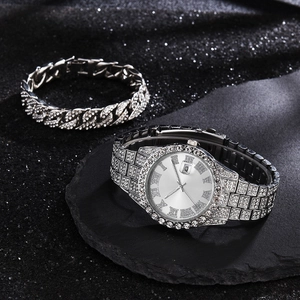 Close-up of silver iced-out hip hop watch and matching diamond Cuban link bracelet