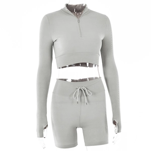 Detail of grey ribbed knit set showing thumb hole cuffs and drawstring waistband