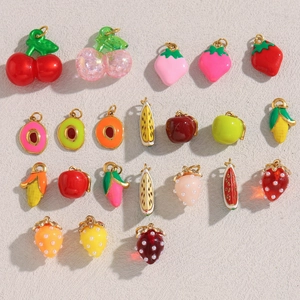 Close-up of 18K gold plated fruit charms including strawberry and cherry for DIY jewelry