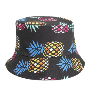 Black reversible bucket hat with colorful pineapple print for women sun protection