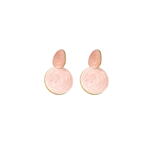 Detail of pink marble texture earrings with golden metal borders in a two-tier design