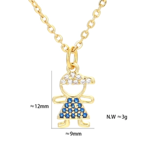 Detailed macro shot showing dimensions of the gold girl pendant with blue zircons