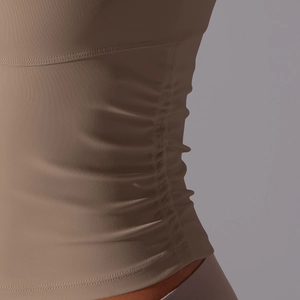 Vue détaillée d'un haut de sport marron café avec des coutures froncées extensibles