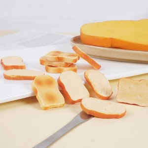 Miniature realistic PVC toast models for keychains and DIY crafts on white tray